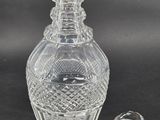 an image of a clear glass bottle with a stopper