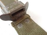 a close up of a belt with a gun inside of it