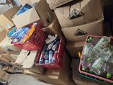 many boxes of sodas and cans of soda on the floor