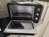a toaster oven that is open on the counter