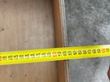 someone is measuring the width of a drawer with a tape