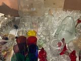 a lot of glass items that are on the table