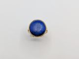 a gold ring with a lapis stone in the center