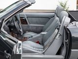 the interior of a car with the door open and the driver ' s seat down