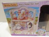 a box that has a doll house inside of it