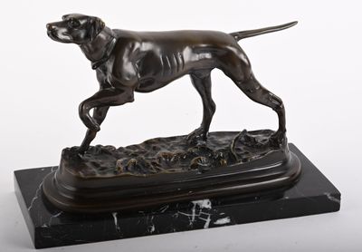 bronze statue of a dog on a marble base on a white background