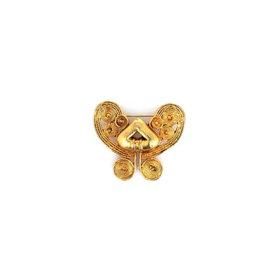 an image of a gold butterfly broochle on a white background
