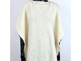 a woman wearing a white sweater on a mannequin mannequin mannequin mannequin mann