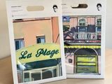 packaging design for a set of two sets of coasters with a picture of a building on the front and a picture of a building on the back