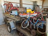 a truck with a trailer full of bicycles and a horse
