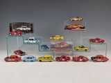 a lot of toy cars on display in a display case