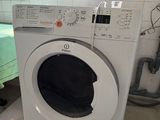 a washer and dryer in a small room