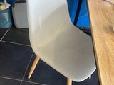 a chair that is sitting in front of a desk