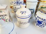 many different types of jars and containers on the table