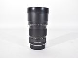 a close up of a camera lens on a white surface