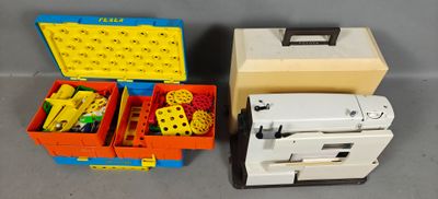 two boxes of legos and a sewing machine on the table