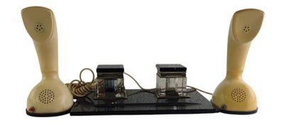 two telephones that are sitting on a table