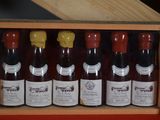 six bottles of wine in a wooden box