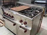 a large stainless steel stove with two burners and two ovens