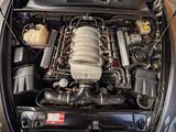 an image of a car engine with its hood open