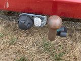 a rusted fire hydrant on the ground next to a red car