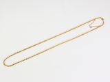 an image of a gold necklace on a white background
