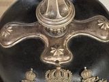 a black helmet with a gold crown on it