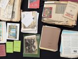 many old books on a table with a black table cloth
