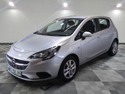 a picture of a silver car parked on a checkered floor