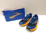 pair of blue and orange running shoes next to a box of blue and yellow shoes