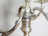 a silver candelier that is sitting on a table