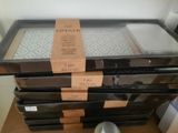 four pans stacked on top of each other on a table
