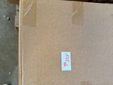 a cardboard box sitting on top of a pile of boxes