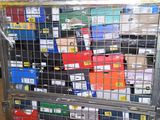 a metal cage filled with many different types of boxes