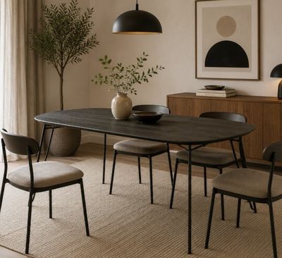 a dining table with chairs and a vase on it