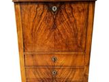 an image of a wooden chest of drawers on a white background