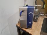 a microwave sitting on top of a table in a kitchen