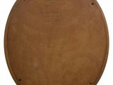 brown round wooden table with writing on top of it