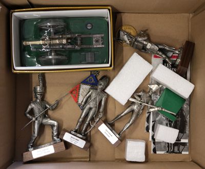 a box full of silver figurines in a box