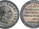 gros plan d'une pièce de monnaie sur laquelle figure un visage de femme