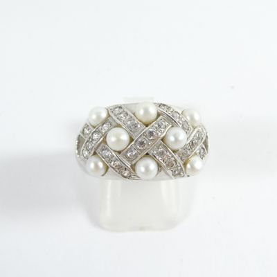 an image of a ring with pearls and diamonds on a white surface