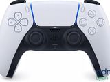 a close up of a video game controller on a white surface