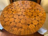 an image of a wooden table with a geometric design on it