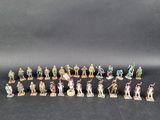 a group of miniature figurines of soldiers and soldiers