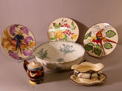 a lot of plates and bowls that are on the table