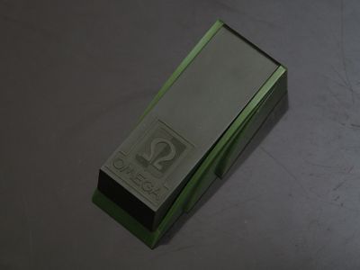 a green box that has a silver label on it