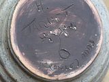 a picture of a close up of a vase with writing on it