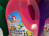 two bottles of liquid sitting on a shelf in a store