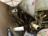a box full of assorted items including a lamp, a vase, and an umbrella