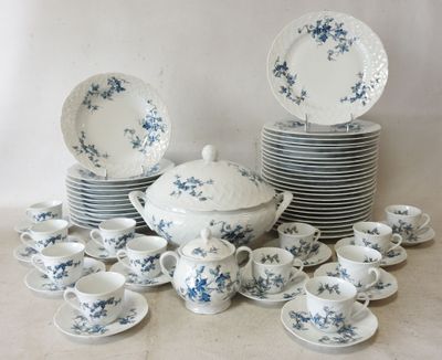 a lot of plates and cups and saucers on the table